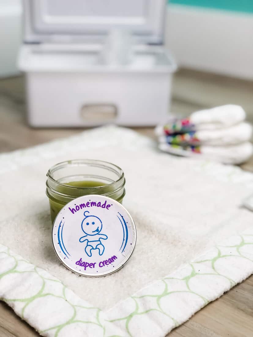 Jar of homemade soothing baby diaper rash cream with calendula and lavender.
