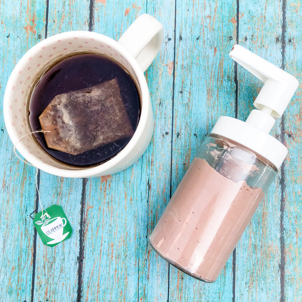 Homemade Black Tea Tinted Bronzing Lotion and cup of black tea.