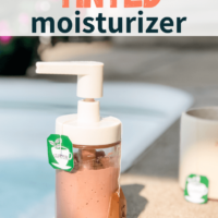 Homemade Black Tea Tinted Bronzing Lotion and cup of black tea with flowers in the background.